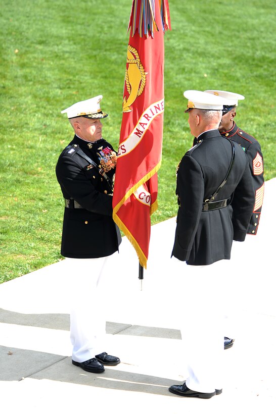 Gen. James Amos recieves the Marine Corps Colors from Gen. James T. Conway during a change-of-command ceremony at Marine Barracks Washington Oct. 22. Conway relinguished command of the Marine Corps to Amos, who became the 35th Commandant of the Marine Corps.